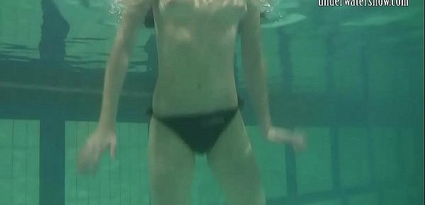  Brunette teen Kristina Andreeva swims naked in the pool